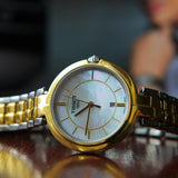 Tissot Flamingo Mother of Pearl White Dial Two Tone Steel Strap Watch For Women - T094.210.22.111.01