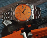 Maurice Lacroix AI6008 Aikon Automatic Date Men’s Watch – Orange Dial & Silver Steel Strap