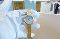Tissot Flamingo Mother of Pearl Dial Gold Steel Strap Watch For Women - T094.210.33.111.00